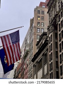 New York City, New York, United States - March 24, 2022: 20th Century Buildings In Manhattan's East Side Flanked By The American And New York State Flags To The Left.