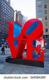 New York City, Usa, 16/09/2014: skyline of the city with view of the Love sculpture, an iconic Pop Art work by american artist Robert Indiana at the intersection of Sixth Avenue and W 55th Street