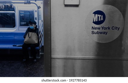 New York City, New York, USA: 3-01-21- Elderly Woman Wearing Face Mask In The Subway Transit NYC During Covid 19 Pandemic