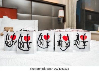 New York City, USA - April 6, 2018: Many I Heart Love NY NYC Gift Bags On Hotel Room Bed As Wedding Favors Closeup