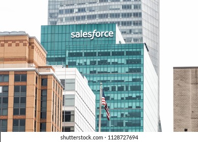 New York City, USA - April 7, 2018: Aerial view of urban cityscape, skyline, rooftop building skyscrapers in NYC Herald Square Midtown with Salesforce office sign, American flag