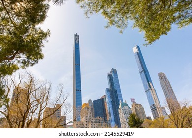 New York City, USA - April 2nd 2022: Steinway Tower With Central Park Tower And Other Buildings At Manhattan.  Low Angle View From Central Park.