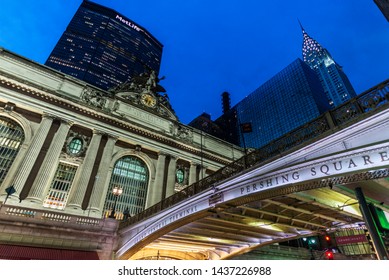 New York City, USA - August 1, 2018: Facade Of The Grand Central Terminal, Commuter Rail Terminal, At Night With The Chrysler And MetLife Building Located In Midtown Manhattan, New York City, USA