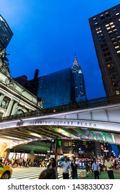 New York City, USA - August 1, 2018: Facade Of The Grand Central Terminal, Commuter Rail Terminal, At Night With  The Chrysler Building In The Background In Midtown Manhattan, New York City, USA