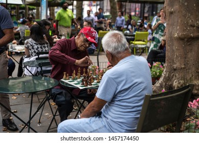 New York City, USA - August 2, 2018: Elderly People Playing Chess In Bryant Park, Midtown Manhattan, New York City, USA