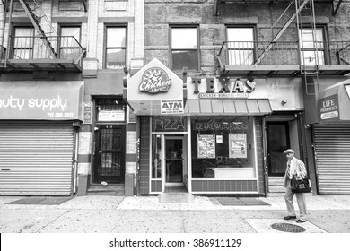 NEW YORK CITY, USA - AUGUST 16, 2015: Man Walking On A Street Of Harlem. Since The 1920s, Harlem Has Been Known As A Major African American Residential, Cultural And Business Center. 