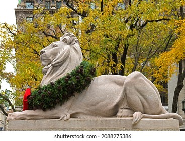 NEW YORK CITY, USA - DEC 1, 2021: Lion of New York Public Library with Christmas decorations on Fifth Avenue