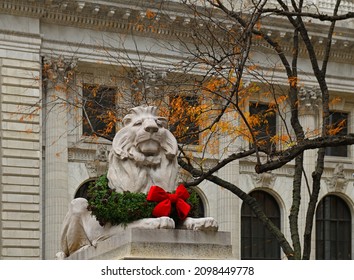 NEW YORK CITY, USA - DEC 1, 2021: Majestic Lion of New York Public Library with Christmas decorations