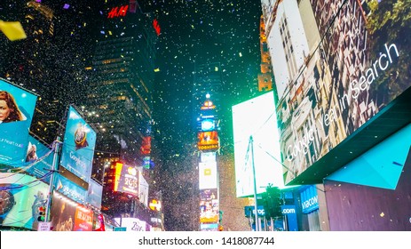 New York City, USA, December 31, 2014, Extreme Party Atmosphere On Street Intersection Of Times Square On New Year's Eve Midnight After Ball Drop When Confetti Flies All Over The Place