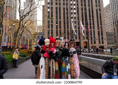 NEW YORK CITY, USA  - DECEMBER 9TH 2021: people enjoying holiday lights and Christmas Displays at Rockefeller Center and Saks Fifth Avenue. Very few are wearing facial masks despite Omicron pandemic.