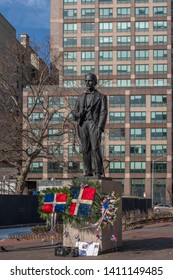 New York City, USA - Feb. 28, 2019: Statue of Juan Pablo Duarte, one of the founding fathers of the Dominican Republic, at Duarte Square, with Dominican flags and flowers