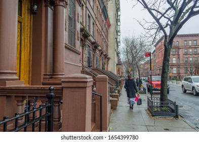 New York City, USA - Jan 4th 2015: Sidewalk In Harlem Neighborhood.  People Walking Across The Pavement. Urban Street Photography.