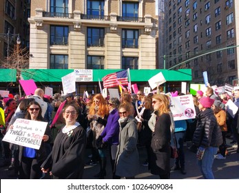 New York City, New York / USA - January 20 2018: Women's March: A Woman Wears A Judge's Robe While Another's Sign Quotes Martin Luther King Jr., 