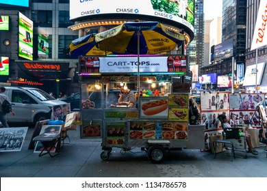 New York City / USA - JUL 13 2018: Times Square Street Food Cart At Rush Hour In Midtown Manhattan