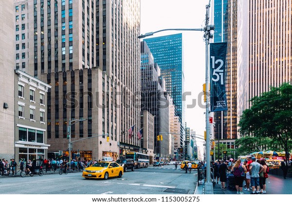 New York City / USA - JUL 19 2018:\
Avenue of the Americas streets, and buildings facade, store,\
restaurant and cafe and apartments in Midtown\
Manhattan