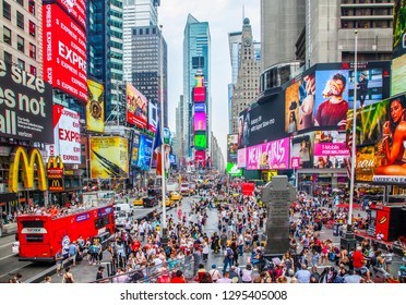 New York City, New York, USA - July 3, 2018; Times Square Crowded With Tourists And LED Billboards Where People Enjoy Manhattan Attractions During Daytime On July 3, 2018 In New York CIty