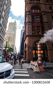 New York City, USA - July 26, 2018: Orange And White Smoke Stack Steam Pipe With People Around In Manhattan In New York City, USA