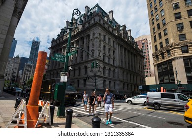 New York City, USA - July 27, 2018: Orange And White Smoke Stack Steam Pipe With People Around In Centre Street, Manhattan,  New York City, USA