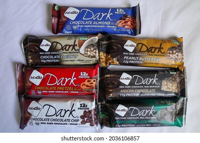 New York City, New York  USA - July 15, 2021: Rows Of NuGo Dark Protein Bars -- Chocolate Almond, Coconut, Pretzel, Chocolate Chip, Peanut Butter Cup, Mocha Chocolate, And Mint Chocolate Chip. 