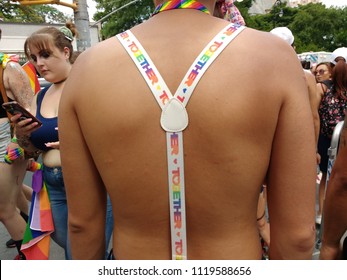 New York City, New York / USA - June 24 2018: Together: A Person Wears Rainbow Suspenders At NYC Pride 2018.

