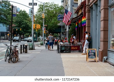 New York City, USA - June 22, 2018:  Sidewalk Cafe Decorated With Gay Pride Rainbow Flags In Greenwich Village