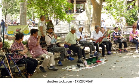 New York City, USA - June 29, 2016: Elderly Men Playing Traditional Chinese Music In A Park In Chinatown, Manhattan