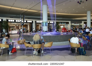 NEW YORK CITY, USA - JUNE 24, 2022: LaGuardia Airport, Civil Airport In East Elmhurst, Queens, New York City. People Near 25-foot-tall Indoor Fountain In Terminal B