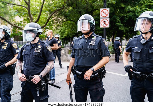New York City, New York / USA - June 1 2020.\
Protests and looting in New York. Looting and rioting protests New\
York City over George Floy death. Police and protesters in\
Manhattan. Police\
brutality.