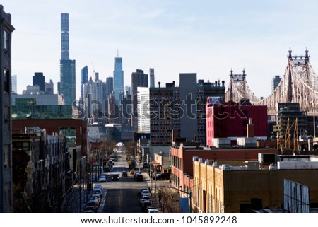 New York City, USA Manhattan cityscape view from subway station in Queens.