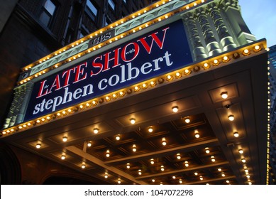 New York City, USA - March 10 2018: Manhattan NYC Buildings In Times Square, Broadway Street Avenue Road, Signs For Colbert Late Show, Angelo's Pizza Italian Restaurant, Marquee / Theatre At Night