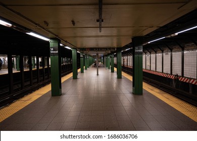 New York City, New York / USA - march 28 2020:
Empty pandemic New York City subways and people riding subway in perspiratory masks and protective gloves during 