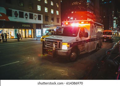 New York City, USA - March 18, 2017: FDNY Ambulance Flashing Lights Siren Blasting In Action In Manhattan. 