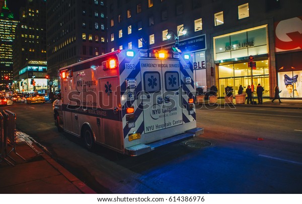 New York City,\
USA - March 18, 2017: FDNY Ambulance flashing lights siren blasting\
in action in Manhattan. 