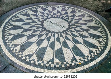 New York City, USA, May 30 2017: Circular pathway mosaic of inland stones with a single word, the title of famous song Imagine, at Dakota in Central Park in New York City, USA.