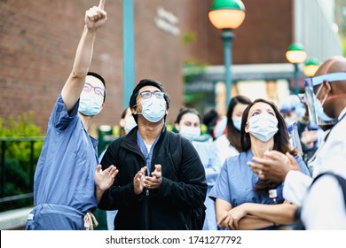 New York City, New York / USA - May 26 2020: New York City Nurses Crying And Cheering As People Clapping Hands In Appreciation Of Frontline Healthcare Workers In Manhattan. 7pm Tradition. Stay Home.