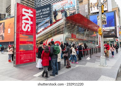 NEW YORK CITY, USA - NOVEMBER 20, 2014 : People Buying Ticket And Looking For Shows In TKTS Discount Ticket Booth For Broadway Shows Of Theatre Devolopment Fund In Times Square New York City.