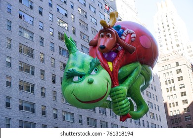 NEW YORK CITY, USA- NOVEMBER 23 2017: The 91st Annual Macy's Thanksgiving Day Parade Attracted Hundreds Of Thousands Of Spectators. The Grinch Who Stole Christmas Balloon