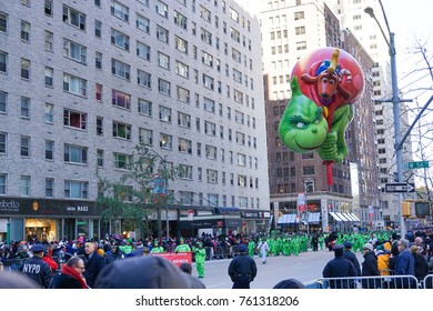 NEW YORK CITY, USA- NOVEMBER 23 2017: The 91st Annual Macy's Thanksgiving Day Parade Attracted Hundreds Of Thousands Of Spectators. The Grinch Who Stole Christmas Balloon