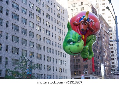 NEW YORK CITY, USA- NOVEMBER 23 2017: The 91st Annual Macy's Thanksgiving Day Parade Attracted Hundreds Of Thousands Of Spectators. The Grinch Who Stole Christmas Balloon