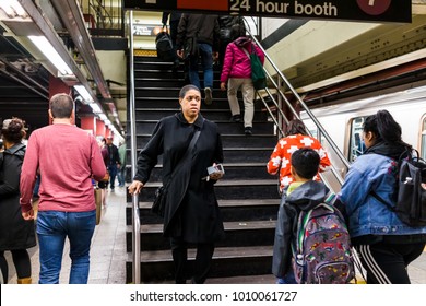 New York City, USA - October 27, 2017: People In Underground Platform Transit In NYC Subway Station After Work On Commute With Train, Woman Walking Down Stairs At Rush Hour