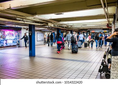 New York City, USA - October 28, 2017: People Walking In Underground Transit By Sign In NYC Subway Station, Exit Sign Port Authority Bus Terminal, By Midtown Times Square