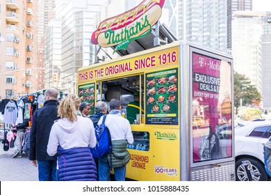 New York City, USA - October 28, 2017: Columbus Circle In Midtown Manhattan NYC, Nathan's Hot Dog Food Truck Stand With Sign, Menu, Line Queue Of People Customers