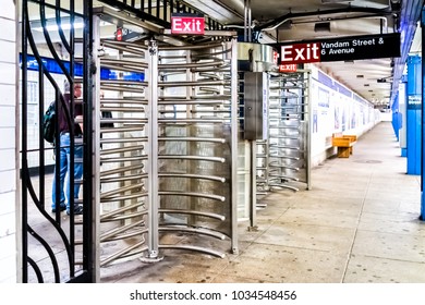 New York City, USA - October 28, 2017: Subway Station Entrance With People In Underground Transit In NYC, Spring Vandam Street Sign Exit At Turnstile