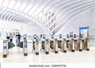 New York City, USA - October 30, 2017: People In The Oculus Transportation Hub At World Trade Center NYC Subway Station, Commute, New Jersey PATH Train Exit Turnstile Machines And Closeup Of Metrocard