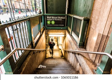 New York City, USA - October 30, 2017: Broadway St By Wall Street Subway Metro Entrance Exit In NYC Manhattan Lower Financial District Downtown, NYSE, Man Walking Up Steps