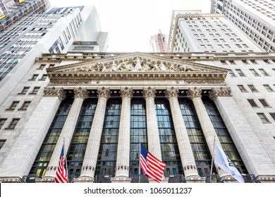 New York City, USA - October 30, 2017: Wall street, NYSE stock exchange building entrance in NYC Manhattan lower financial district downtown, column architecture, American flags