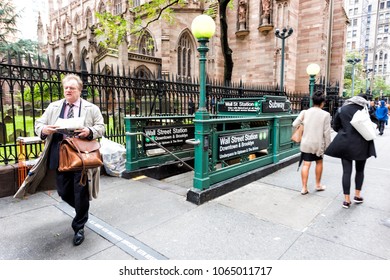 New York City, USA - October 30, 2017: Broadway St By Wall Street, People, Business Businessman With Newspaper Walking From Subway Station In NYC Manhattan Financial District Downtown, NYSE