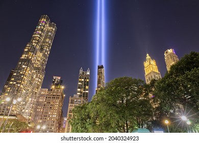 NEW YORK CITY, NEW YORK, USA, SEPTEMBER 11, 2021: New York City's Tribute In Lights On September 11th Among City Skyline