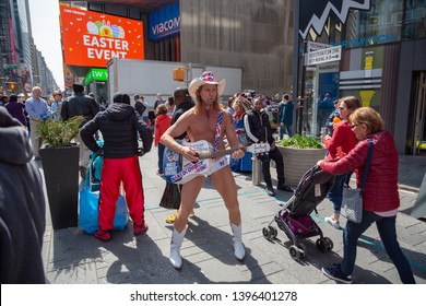 New York City, New York/ USA United States Of America - April 07 2019: Naked Cowboy, Famous NYC Street Performer On A Times Square Wearing Cowboy Boots, A Hat, White Briefs And Guitar. Editorial Use