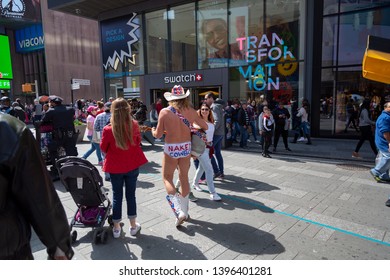 New York City, New York/ USA United States Of America - April 07 2019: Naked Cowboy, Famous NYC Street Performer On A Times Square Wearing Cowboy Boots, A Hat, White Briefs And Guitar. Editorial Use